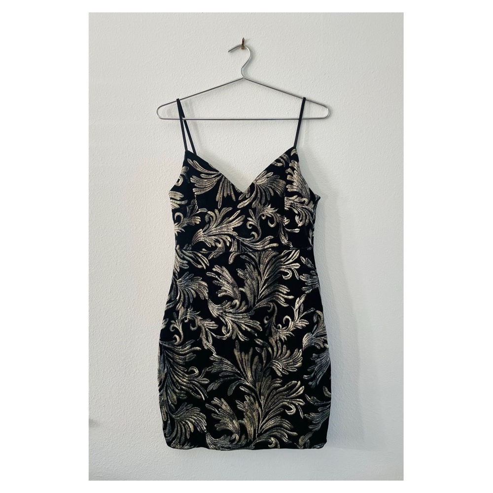 Black Velvet mini dress with embroidered golden pattern.